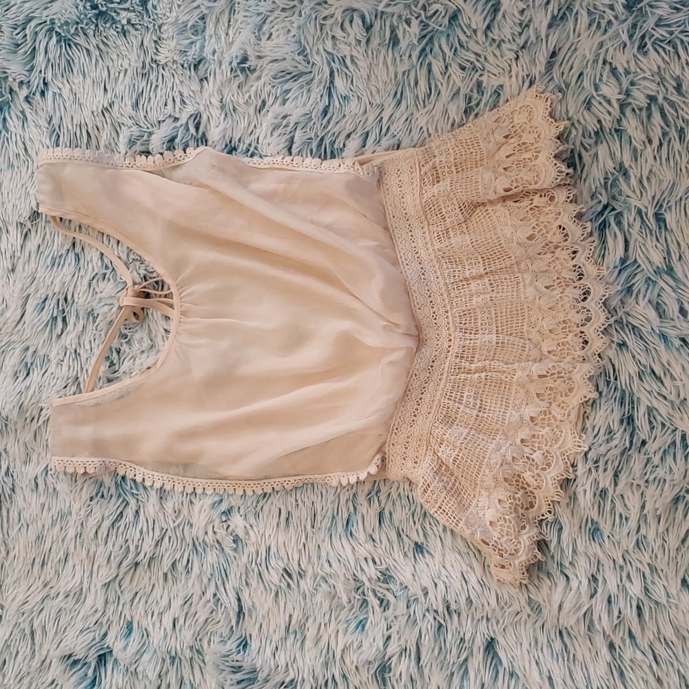Beautiful open-back sleeveless blouse